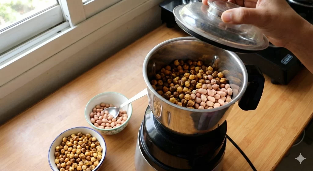 Roasted chana and peanuts inside a mixer grinder jar for making homemade protein powder (Process Shot).
